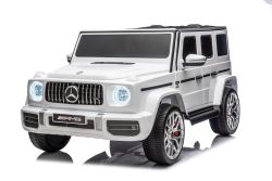 Elektrisches Kinderauto Mercedes-Benz G63 AMG 4x4, Zweisitzer, weiß, MP3-Player mit USB/AUX- und Bluetooth-Anschluss, Allradantrieb (4x4), Lithium-Batterie, EVA-Räder mit Federung, Kunstledersitze, Fernbedienung, lizenziert